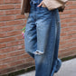 JEANS BAGGY CON RISVOLTO IN CINTURA E ROTTURE